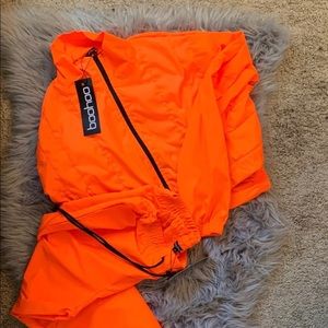 Neon orange cropped jacket, and pants